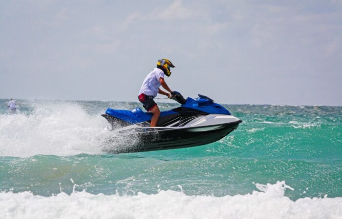 young-man-professional-jet-ski-rider-performs-many-tricks-waves